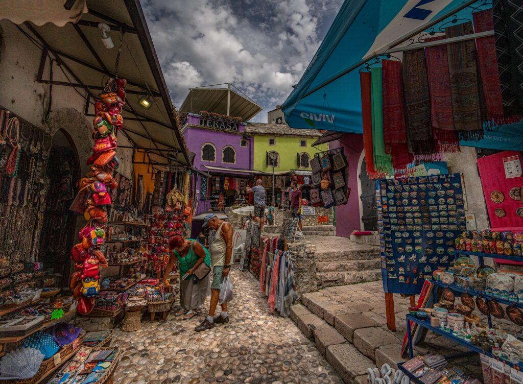people wandering about the markets in the city of Mostar.
